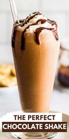 the perfect chocolate shake is in a tall glass with a straw sticking out of it