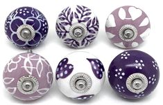 six different colored knobs with designs on them