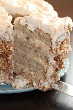 a close up of a slice of cake on a plate with another piece in the background