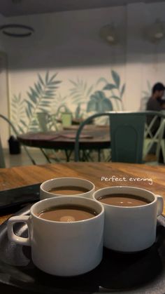 three cups of coffee sitting on top of a plate