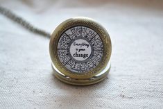 "This necklace is inspired by The Maze Runner.The picture is the Maze with a quote in the movie\"Everything is gonna change\" The watch is a real work one. Please turn up the top knob and turn to adjust the time.When set ready,please press the knob down to get back to work. Size of the watch is approx 35mm (1.3in) diameter.The size of the picture pendant is 2.5cm/1in.It is covered by a clear cabochon resin.Then it will show a cute 3D effect.A 80cm/31inches chain is used. If you need it to be longer or shorter,please just leave me a note when make order or sent me a convo. All the material is all nickel free. Item will come with nice gift packing. Please notice the material is not waterproof,please take off it before bath or swim. For more amazing items,please click here https://www.etsy.co Hunger Games Jewelry, Runners Jewelry, Delicate Diamond Necklace, The Maze Runner, Necklace Quotes, Picture Pendant, Gifts For Runners, Diamond Choker, Diamond Solitaire Necklace