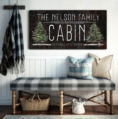 the nelson family cabin is established on this rustic bench with plaid pillows and throw pillows