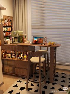 a small bar with two stools next to it