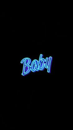 a neon sign that says baby on it in blue and green lights against a black background