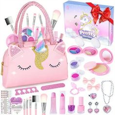 a pink purse with unicorn makeup and accessories