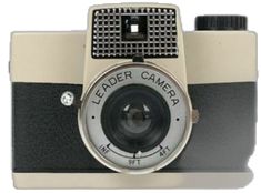 an old fashioned camera with a lens attached to it's front cover and the words leader camera on the side