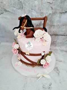 a cake shaped like a horse with flowers on it