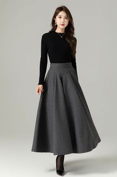 "Fluidity and elegance from this chic winter skirt. Team the wool skirt with a chunky sweater, winter boots and an over sized handbag and you're good to go, no matter what the weather throws at you!  You'll really be able to turn on the charm with this versatile long pleated skirt. The gray color means that you'll match it with literally everything you own. This A line skirt will soon become a staple in your winter wardrobe collection.  DETAIL * 30% wool, 30% fiber, 40% polyester * polyester lining * Two side Seam pockets * Back zipper closure, Back elastic make it more comfortable when wear * Ankle length effect * A Line maxi skirt * Dry clean *  Lean More about the items From the FAQs on the page bottom MODEL SIZE Bust 85 cm(33.4\")  Waist 67 cm(26.7\")  Height 168cm (5' 6\") She wears s Gray Maxi Skirt Outfit For Fall, Long Skirt Reference, Pleated Skirt Work Outfit, Turtle Neck With Skirt, Long Skirts Winter, Skirt Outfits For Winter, Skirt Outfits Winter, Elegant Skirt Outfits, Maxi Pleated Skirt