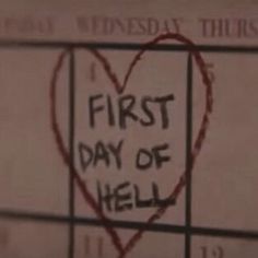 a heart with the words first day of hell written on it in front of a calendar