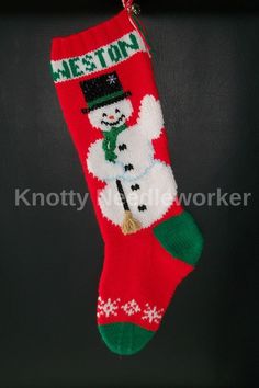 a christmas stocking with a snowman on it