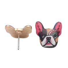 a pair of earrings with a dog's face on it and a gold ear pin