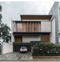 a car is parked in front of a modern house with wooden shutters on the windows