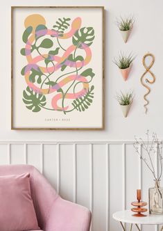 a pink chair sitting in front of a white wall next to a table and potted plants