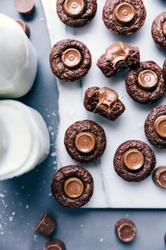 chocolate cookies and marshmallows are on a tray