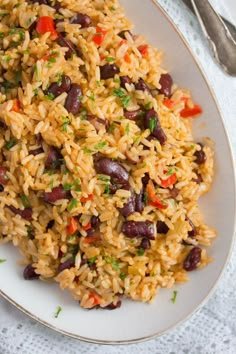 rice with beans and carrots on a white plate