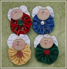 three little buttons are hanging on some fabric