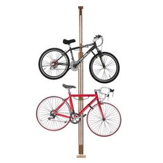 a bike is mounted to a pole with two bicycles on it