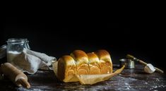 a loaf of bread sitting on top of a wooden table