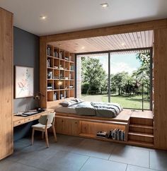 a bedroom with a bed, desk and bookshelf next to a large window