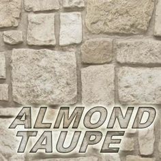 a stone wall with the words almond taupe on it