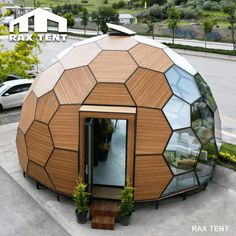 a round wooden structure sitting on top of a sidewalk