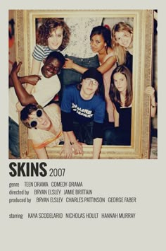 a group of people posing for a photo in front of a framed image with the words skins 2007 written on it