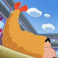 an animated image of a man with a large chicken on his head