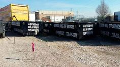 there is a truck that has some signs on the back of it's trailer