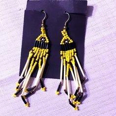 Hanging Yellow And Black Bead Earrings. Brand New Yellow Beaded Earrings With Ear Wire For Festivals, Yellow Beaded Drop Earrings For Festival, Yellow Beaded Earrings With Black Beads, Yellow Round Beaded Earrings For Festival, Yellow Beaded Earrings For Festival, Adjustable Yellow Beaded Earrings With Ear Wire, Festival Yellow Beaded Earrings With Dangling Beads, Adjustable Yellow Beaded Earrings, Traditional Yellow Beaded Earrings With Dangling Beads