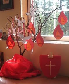 a tree that has been decorated with red paper