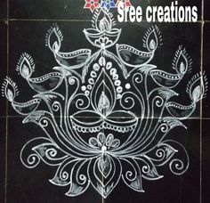 an intricately designed tile with the words free creations written in white chalk on it