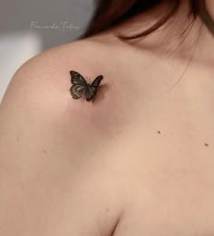 a woman's shoulder with a butterfly tattoo on her left shoulder and the upper half of her breast visible