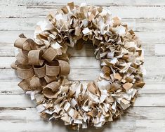 a wreath made out of brown and white paper