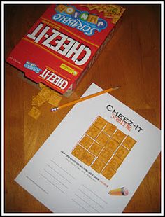 a cheez it game sitting on top of a table next to a box of cheez - it