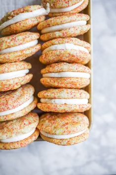 sprinkle covered cookies in a box on a table