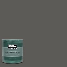 the behr paint is dark gray and it looks like it's being used to paint