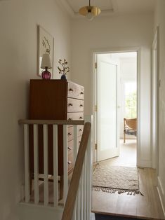 the hallway is clean and ready to be used as a place for storage or other things