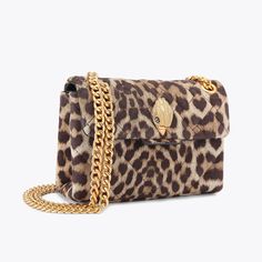 The Mini Leather Kensington is crafted from a leopard printed leather with signature parquet padded overstitch quilting. The brushed gold eagle head sits on the front flap.14cm (H), 20cm (L), 6cm (D)Strap drop cross body: 120cmStrap drop shoulder: 70cmBrushed gold metal chain strap Duo magnetic snap closure hidden under flapBrushed gold metal branded plate on the backCan fit phones up to 7 inchesSmall internal lining pocketOuter: Printed LeatherInterior: Monogrammed interior liningStyle num Luxury Leopard Print Shoulder Bag With Gold-tone Hardware, Luxury Leopard Print Rectangular Bag, Luxury Leather Bags In Leopard Print, Luxury Leopard Print Leather Bag, Luxury Leather Shoulder Bag In Leopard Print, Luxury Leather Leopard Print Shoulder Bag, Luxury Leopard Print Bags For Formal Events, Luxury Tortoiseshell Rectangular Bags, Kurt Bag