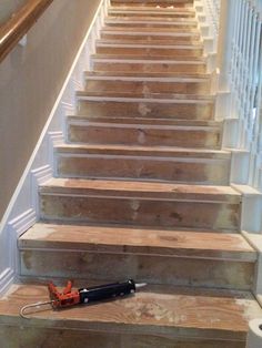 a set of stairs that have been built with wood planks on the bottom and bottom