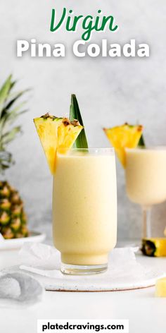 two glasses filled with pineapple drink next to sliced pineapples and text that reads vegan pina cola