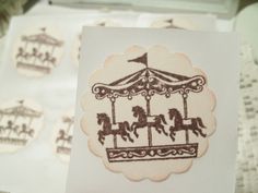 a close up of a piece of paper with a carousel on it