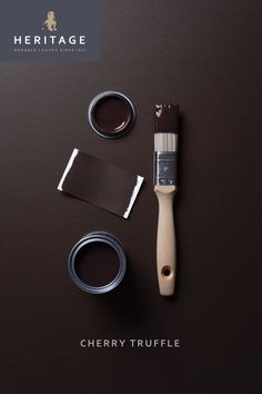 a brown table with some paint and brush next to the words cherry truffle