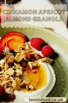 a bowl filled with granola, fruit and yogurt