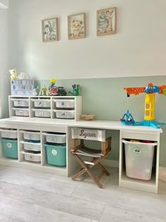 a child's playroom with toys and storage bins