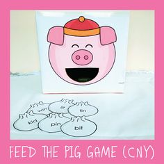 a card with a pig face on it and the words feed the pig game city