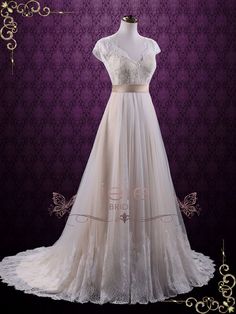 a wedding dress on display in front of a purple background