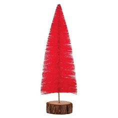 a small red christmas tree on top of a wooden stump