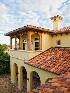 the roof of a house with red tile on it