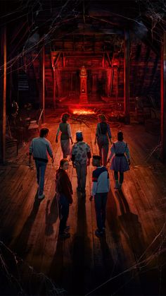 a group of people walking across a wooden floor in front of a red lit doorway