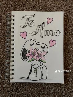 a drawing of a dog with flowers in its mouth and the words te amo above it